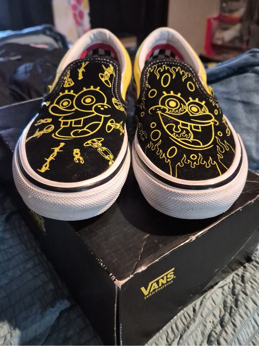 Vans Kids Slip-On Sneakers in Black with Yellow SpongeBob Graphics
